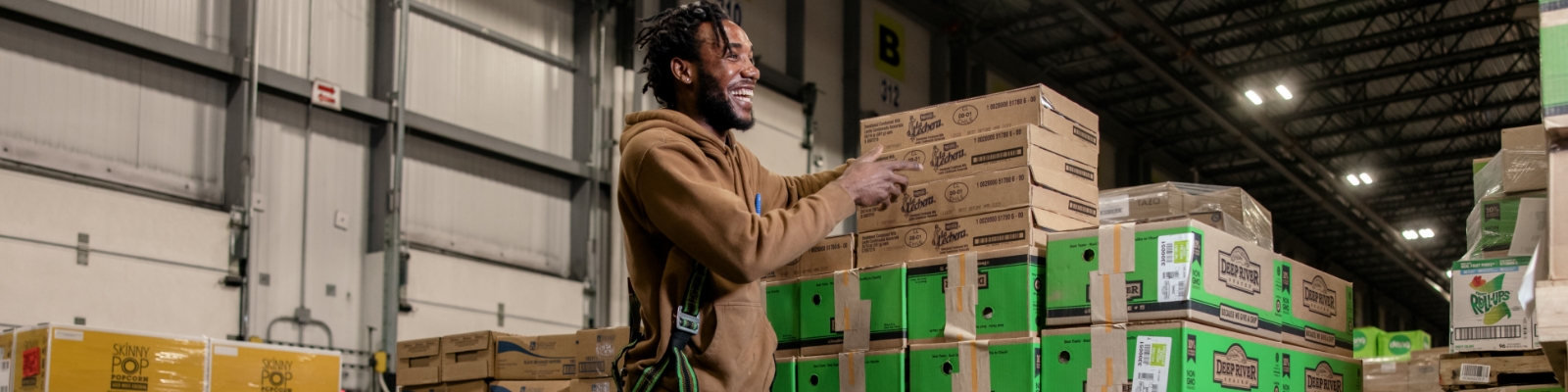 Warehouse worker stacking boxes