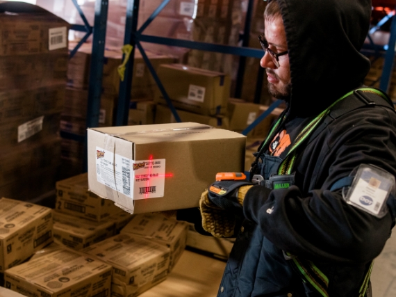 warehouse worker scanning box